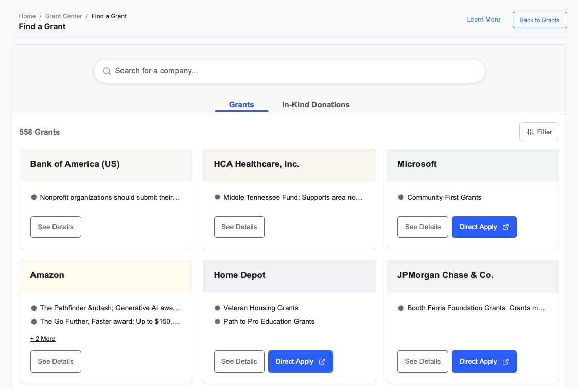 Find a Grant screen with a company search, Grants and In-Kind Donations tabs, and 558 grant cards from funders such as Bank of America, Microsoft, Amazon and JPMorgan Chase with See Details and Direct Apply buttons