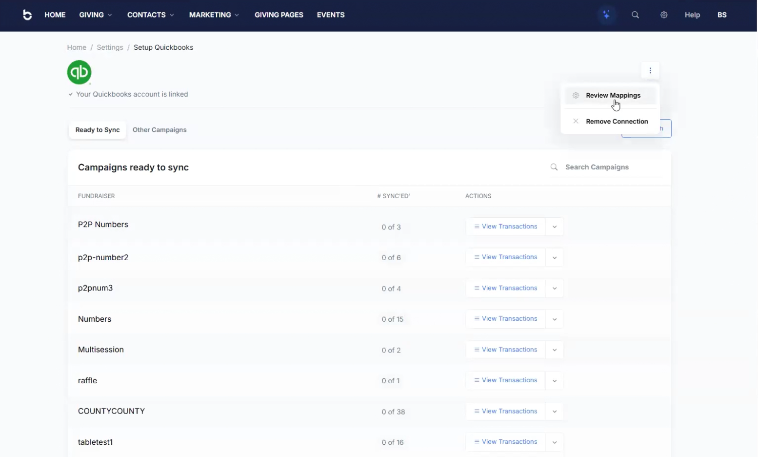 Setup QuickBooks screen with the account linked, a Review Mappings menu, and a list of campaigns ready to sync with View Transactions on each